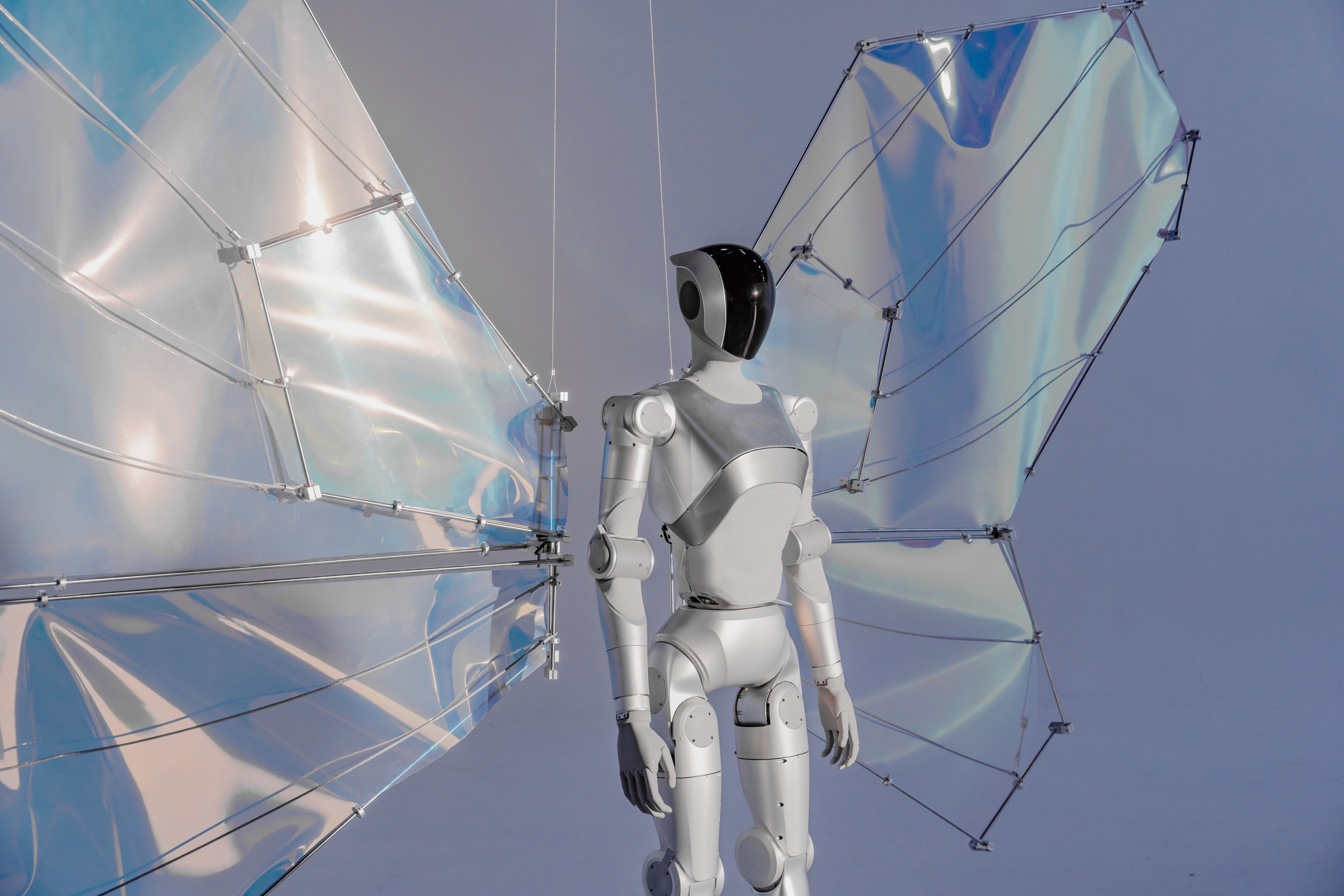 The LimX Luna in a dynamic dancing pose, demonstrating its 27 degrees of freedom